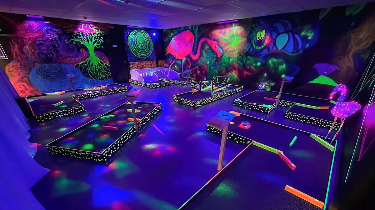 Tee-Off with an 18-Hole Mini-Golf Game in Alice in Wonderland Themed Indoor Golf Space