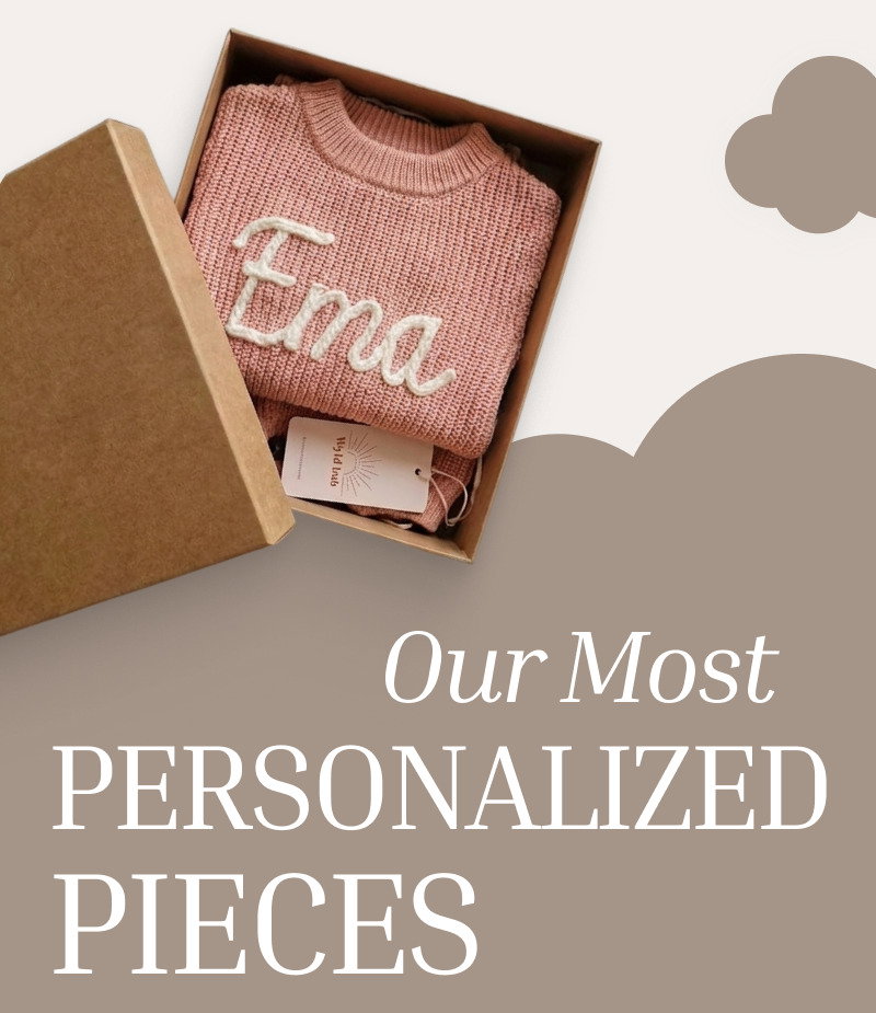 Open gift box containing a personalized knit item above the heading Our Most Personalized Pieces.