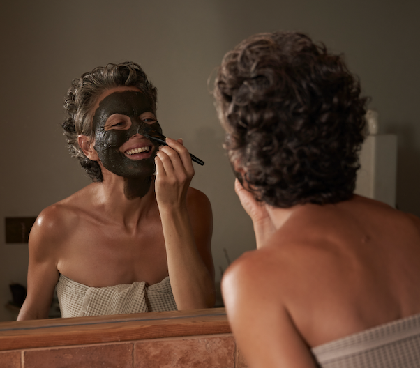 Woman exfoliating with The Problem Solver