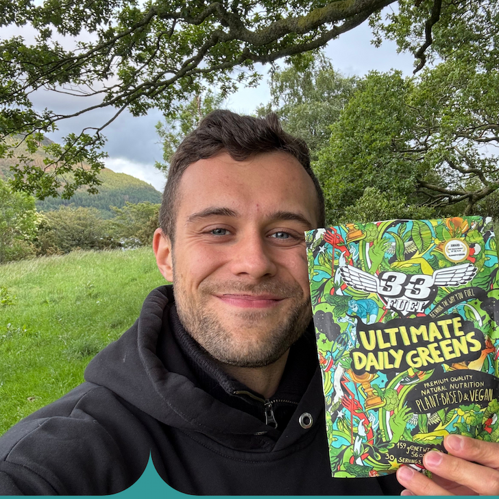 customer holding ultimate daily greens 