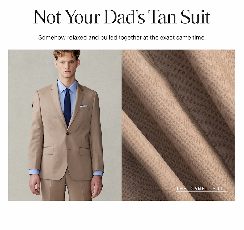 Split layout showing a man wearing a camel suit with a light blue dress shirt and navy tie alongside a close-up of the suit's woven fabric texture. Not Your Dad's Tan Suit Somehow relaxed and pulled together at the exact same time. THE CAMEL SUIT