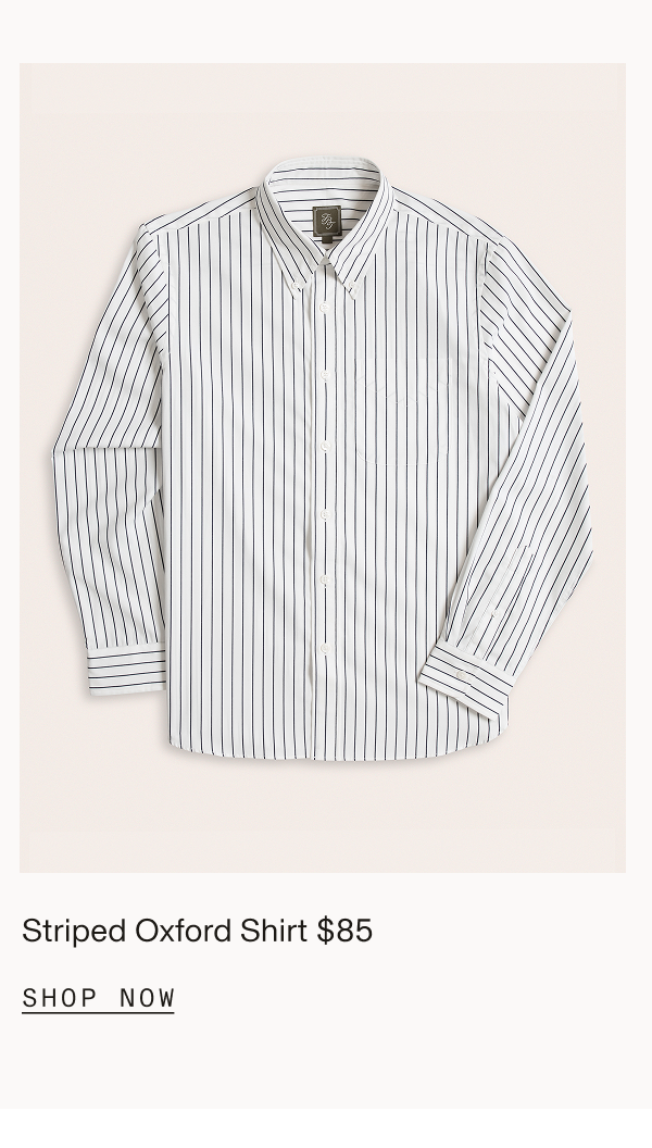 Flat lay of a white and navy vertical striped button-down dress shirt. Striped $85 SHOP NOW