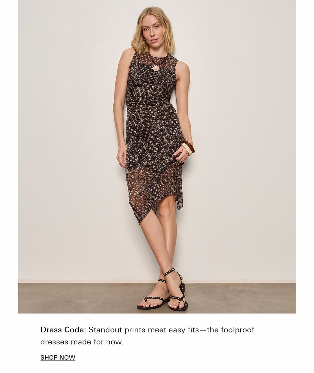 model wearing mesh dress in geometric pattern