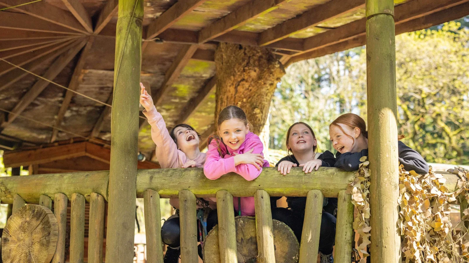 a group of girls smiling and laughing at Camp Smokey on a summer day