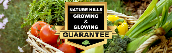 Basket of fresh picked veggies with a badge showing the Nature Hills Growing & Glowing Warranty