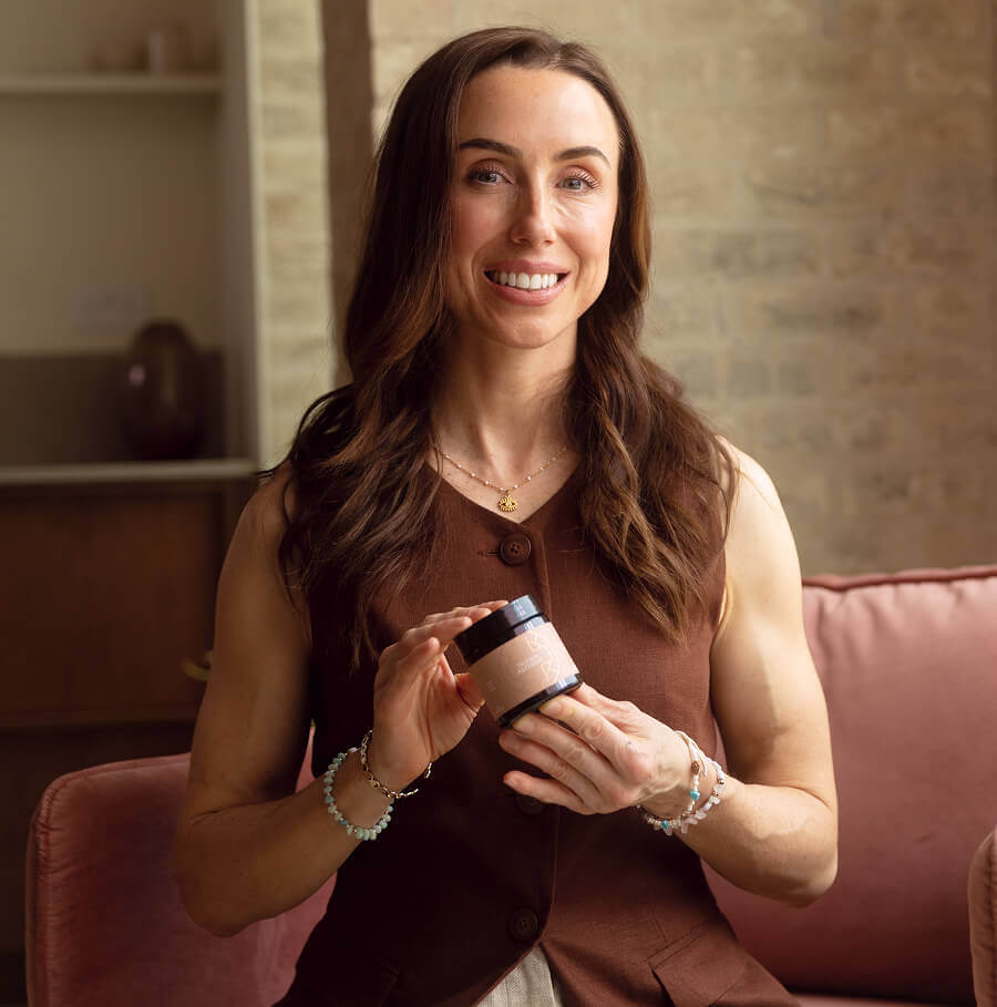 Dr Jenna Macciochi holding a jar of True Skin Alchemy