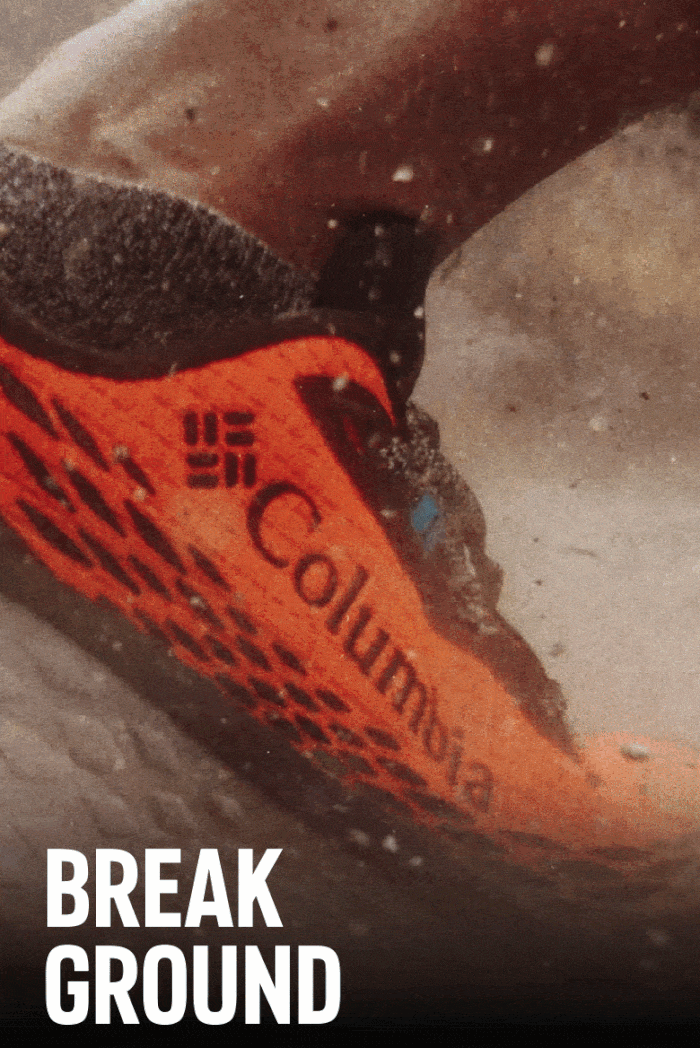 Headline: Break Ground. Visual is of a gif of a man wearing Columbia trail running shoes and stomping on a rock.