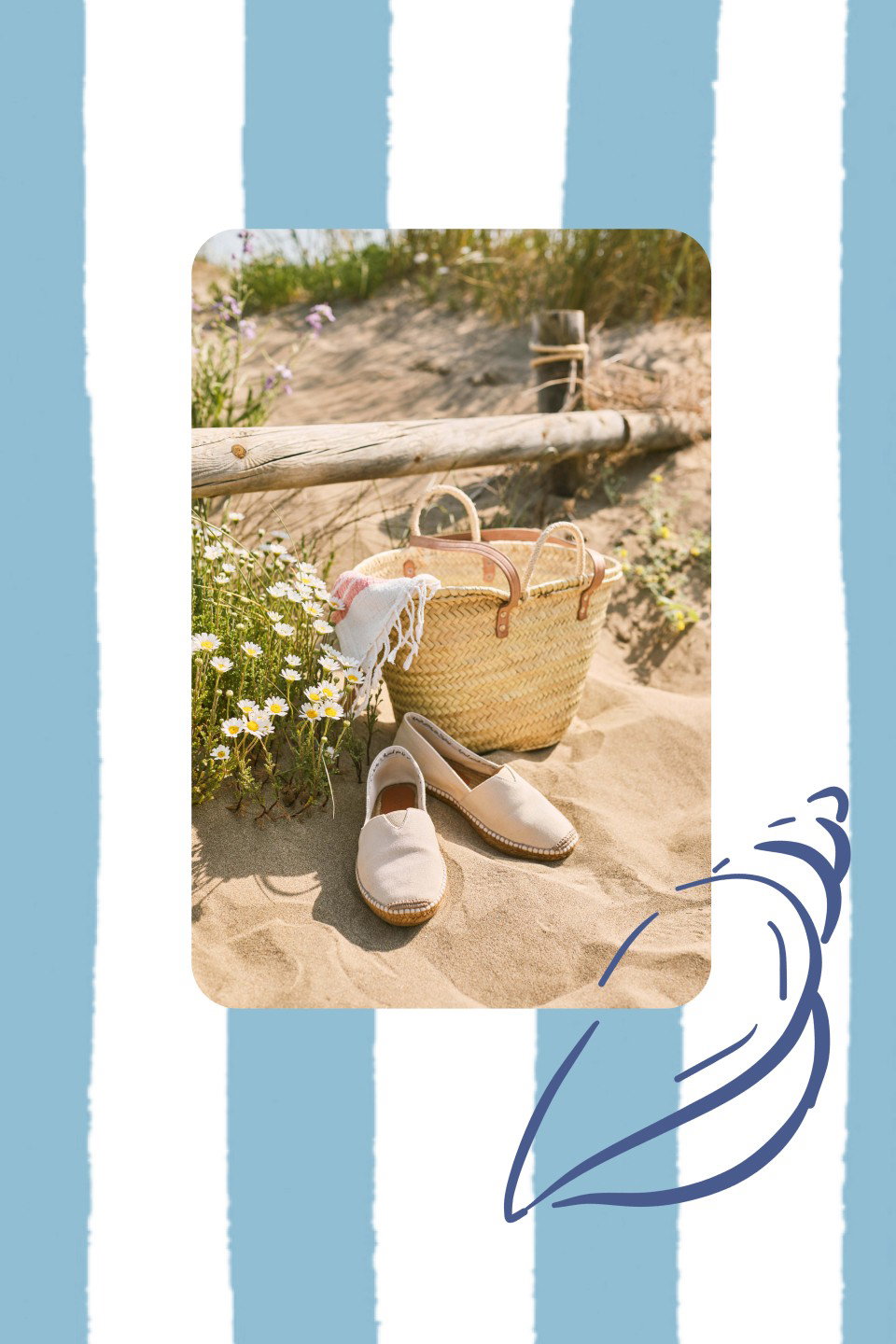 Beige Viscata espadrilles resting on warm sand beside a woven straw tote, white beach cloth, and wild daisies, framed by blue-and-white summer stripes.
