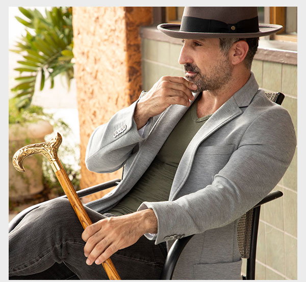 Man holding brass cane