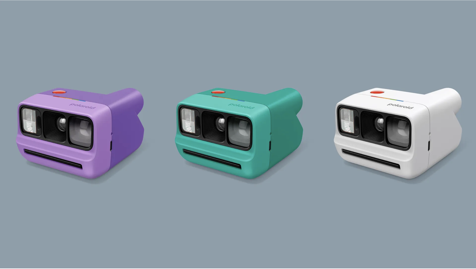 Polaroid instant cameras in purple, green and white