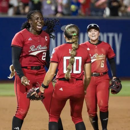 Texas Tech Red Raiders pitcher Nijaree Canady (24) and infielder Jackie Lis (00) and \third baseman Taylor Pannell (6) celebrate after defeating the Alabama Crimson Tide and moving on to play in the final championship series against the Texas Longhorns during the NCAA Women’s College World Series at Devon Park on Jun 1, 2026 in Oklahoma City, OK.