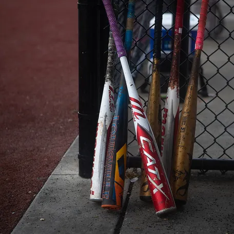 Bats are seen in a dugout during the youth Grand Slam World Series of Baseball Tournament at Publix Sports Park in Panama City Beach, Florida on June 20, 2014.