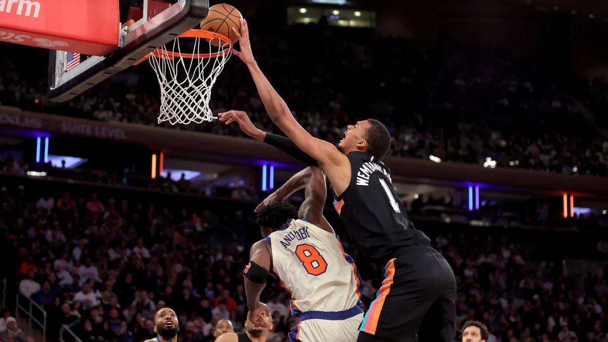San Antonio Spurs forward Victor Wembanyama (1) dunks over New York Knicks forward OG Anunoby (8) Mar 1, 2026 at Madison Square Garden. Brad Penner-Imagn Images