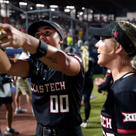 Texas Tech's Jackie Lis (00) celebrates with Brianna Hinson following a Women's College World Series softball game between Texas Tech Red Raiders and the UCLA Bruins at Devon Park in Oklahoma City, May 31, 2026.