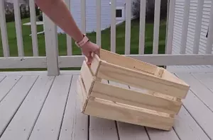 She flips a crate on her porch for this clever outdoor idea
