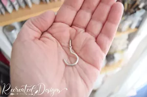 She hung cup hooks around her closet light fixture for this beautiful upgrade
