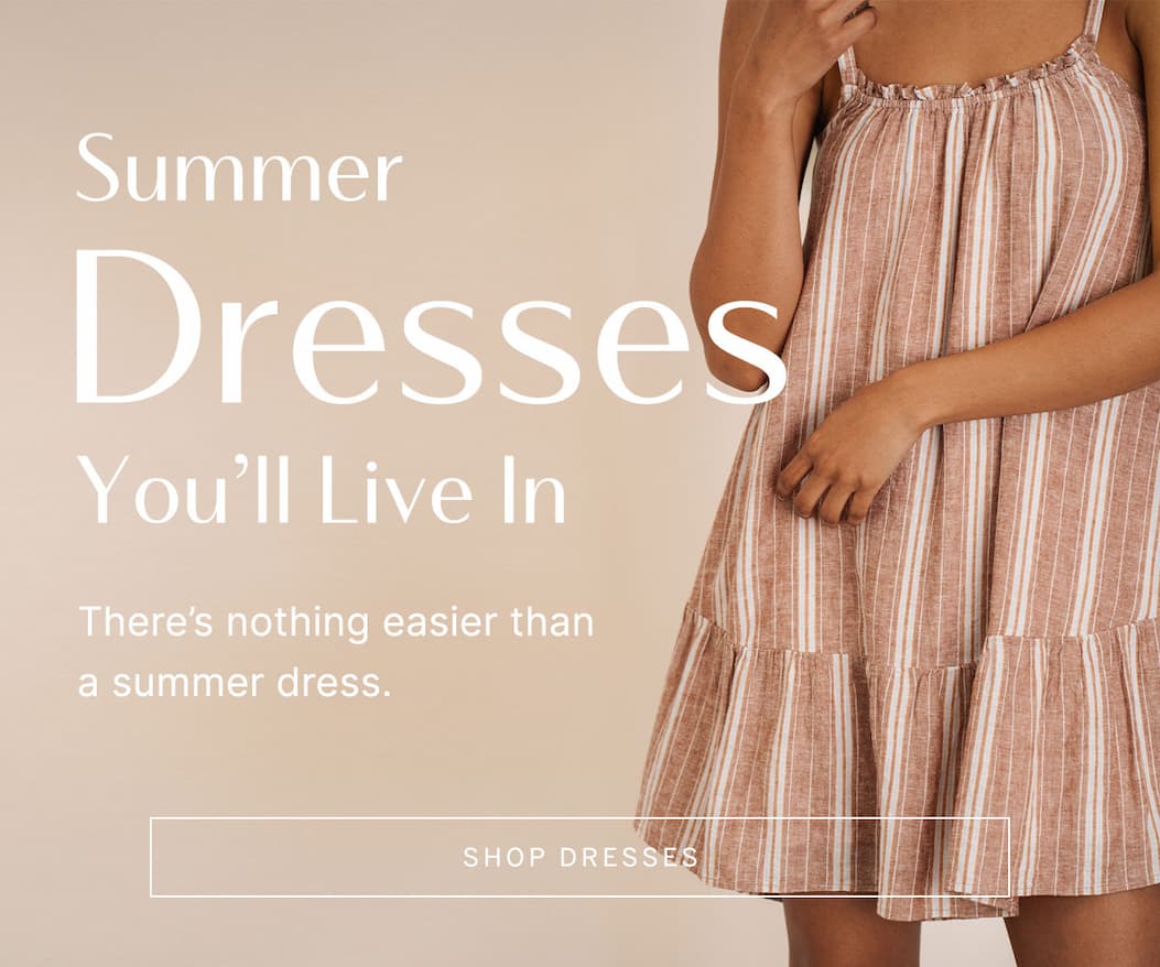 Close-up of a striped sleeveless summer dress in neutral tones. Text reads: “Summer Dresses You’ll Live In. There’s nothing easier than a summer dress.”