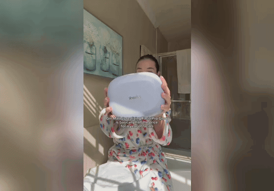 Woman using the FacialPro Glow.