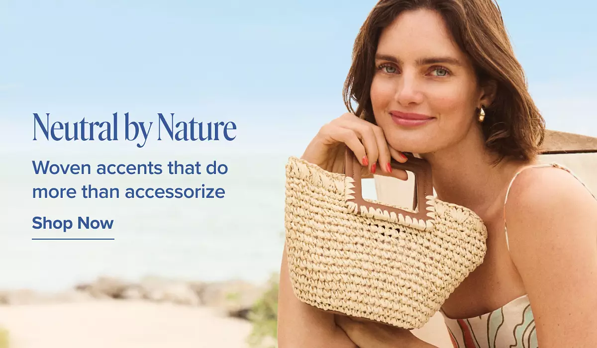 Neutral by nature. Woven accents that do more than accessorize. Shop now. A woman in a chair on the beach with a woven handbag.