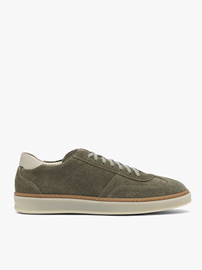 Olive green suede trainer with white sole and laces on a white background.