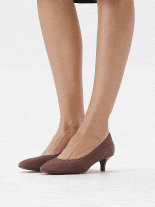 Collage of brown low-heeled shoes worn by a model, showcasing different angles.