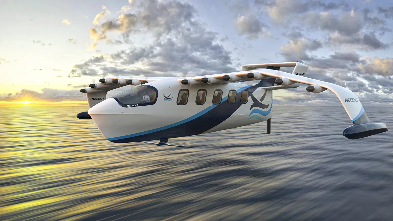 White and blue Regent sea glider with multiple engine pods mounted along a high wing, gliding over a calm sea at sunset under a cloudy sky.