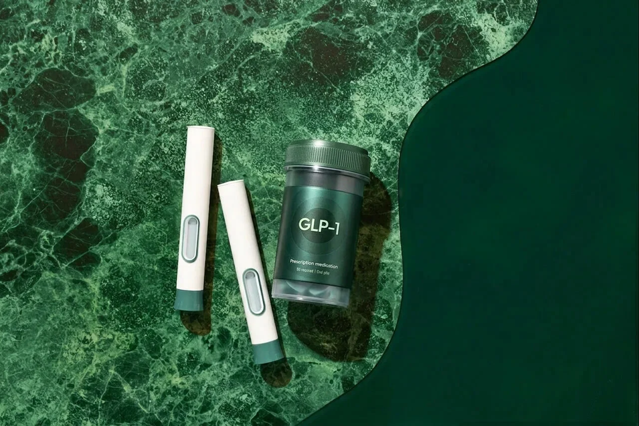 GLP-1 prescription bottle next to two pens