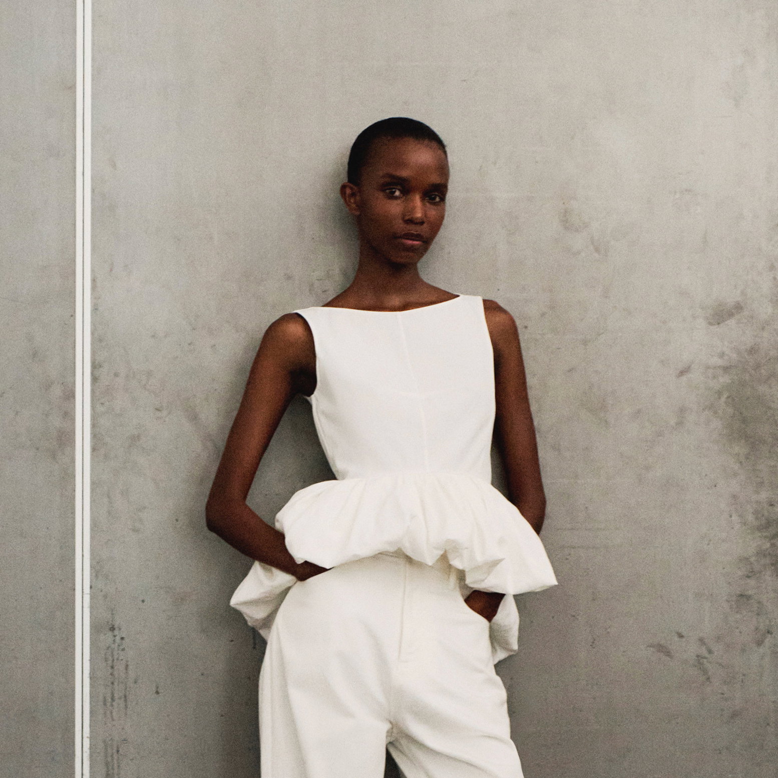Image of a model wearing the anais top in cotton poplin white