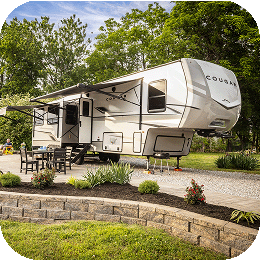 A large RV at a KOA campsite.