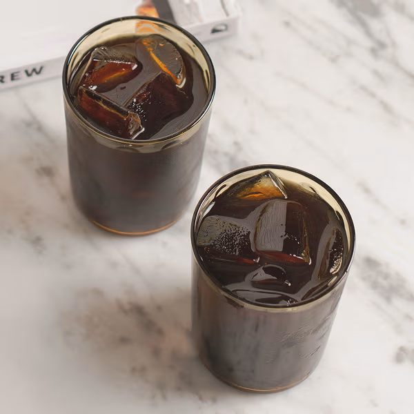 Glass of Peet's cold brew & glass of iced coffee