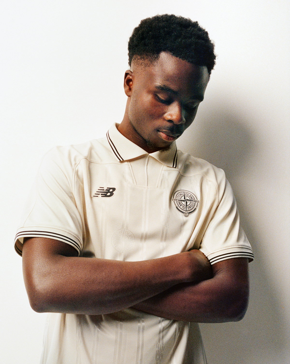 Hero Bukayo Saka wearing Stone Island x New Balance