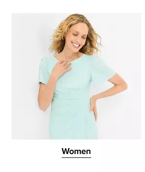 A woman in a green dress. Shop women.