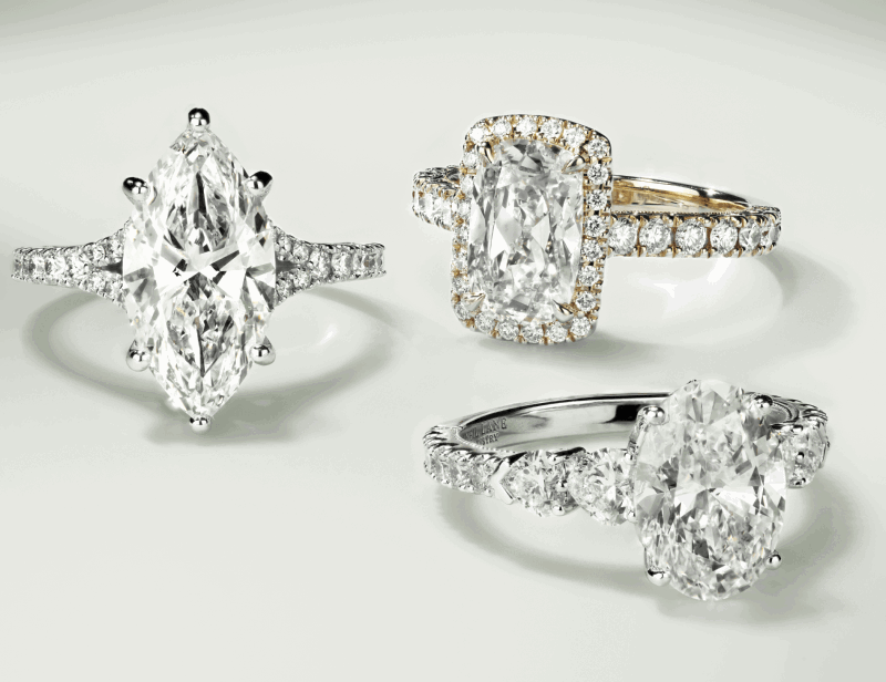 Engagement rings featuring marquise, elongated cushion, and pear-shaped diamond center stones with pavé details.
