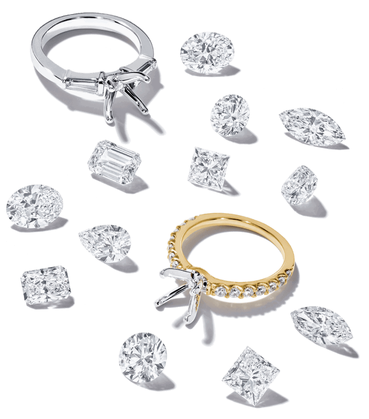 Yellow gold and white gold engagement ring settings with assorted loose diamond cuts.