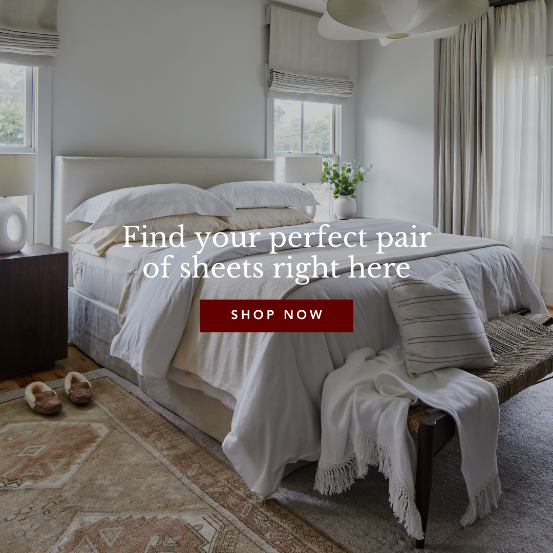 A neatly made bed with white bedding in a bright, serene bedroom.