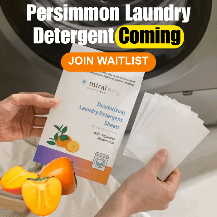 A person holds a package of Mirai Clinical Deodorizing Laundry Detergent Sheets with Japanese Persimmon, with sliced and whole persimmons in the foreground. The text (square)