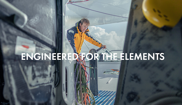 Man grinding on IMOCA boat