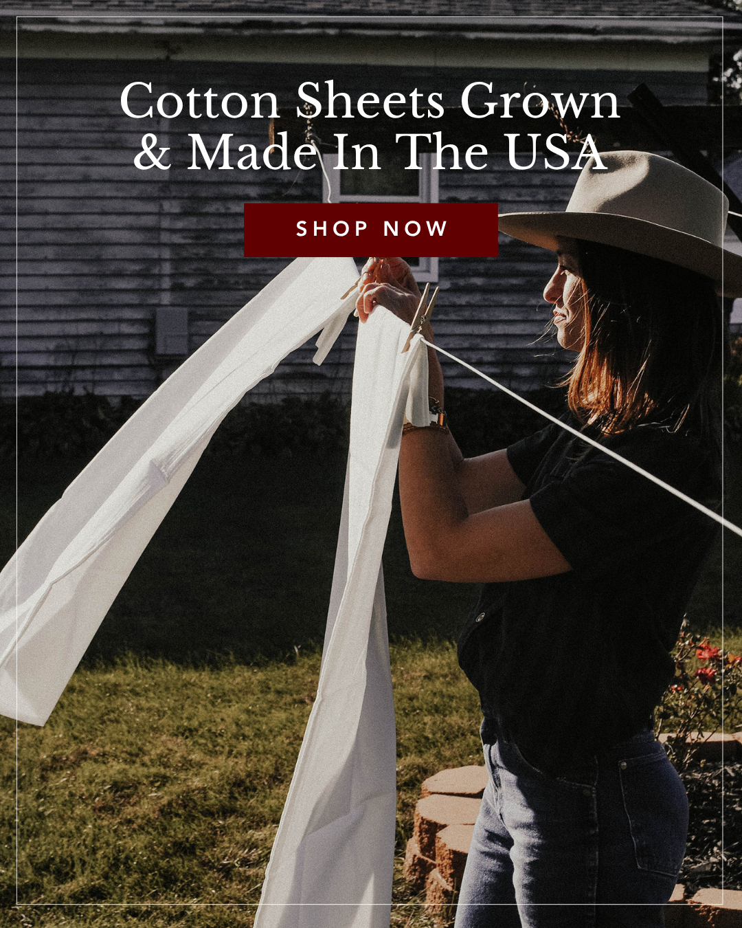 A woman in a sun hat hangs a white sheet on a clothesline in a backyard. Overlay text reads: Cotton Sheets Grown & Made In The USA. Shop Now.