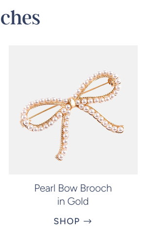 pearl bow brooch in gold
