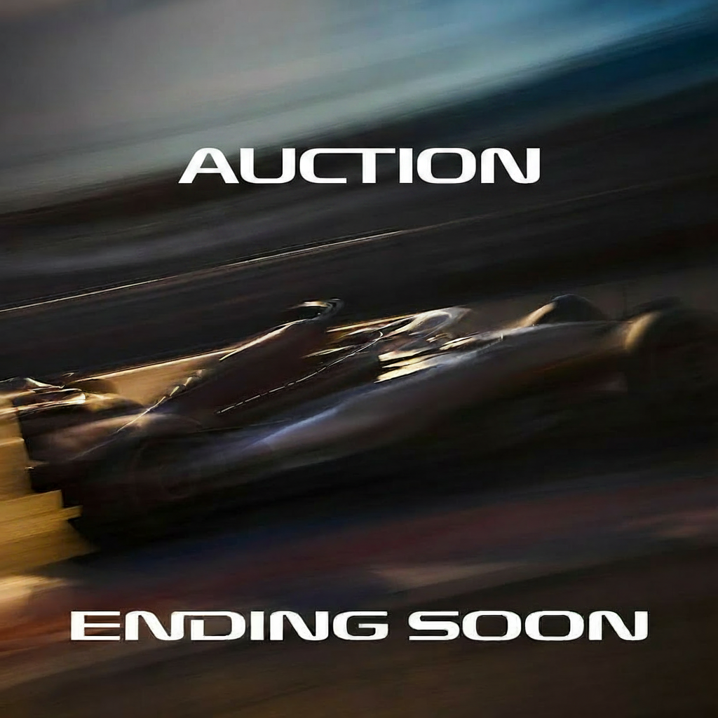 An auction is ending soon, with a blurred image of a race car.