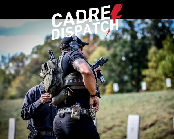 Man aiming rifle across truck hood - CADRE Dispatch Blog