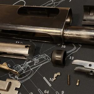 Heavily worn and scratched Wingmaster receiver before refinishing.