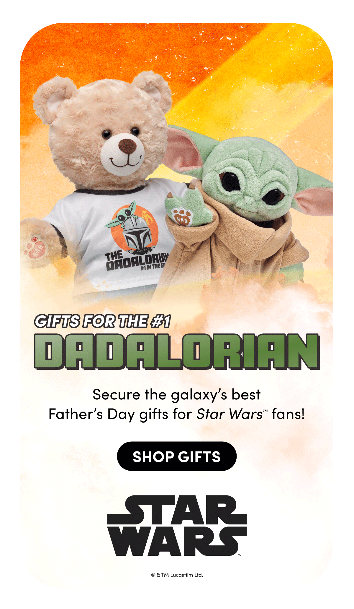 Warm sunset-toned background with soft clouds behind two plush characters: a tan teddy bear wearing a white shirt with a Grogu and Mandalorian helmet graphic, and Grogu in a tan robe holding up a paw with a Build-A-Bear patch. Bold green headline sits below. | Text reads: GIFTS FOR THE #1 DADALORIAN | Secure the galaxy’s best Father’s Day gifts for Star Wars fans! | SHOP GIFTS | STAR WARS