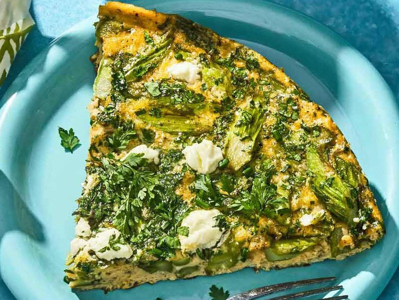 A slice of the asparagus frittata on a plate.