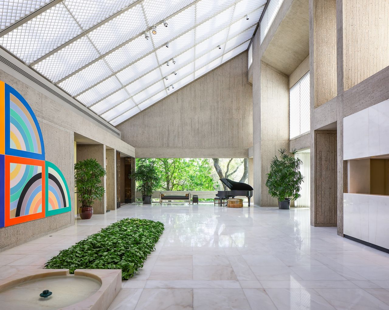 concrete house exterior with triangular-profile roof