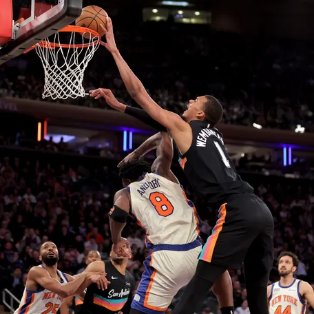 San Antonio Spurs forward Victor Wembanyama (1) dunks over New York Knicks forward OG Anunoby (8) Mar 1, 2026 at Madison Square Garden. Brad Penner-Imagn Images