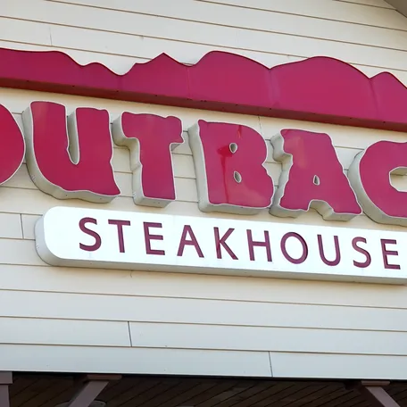 A sign marks the location of an Outback Steakhouse restaurant on November 02, 2021, in Skokie, Illinois.