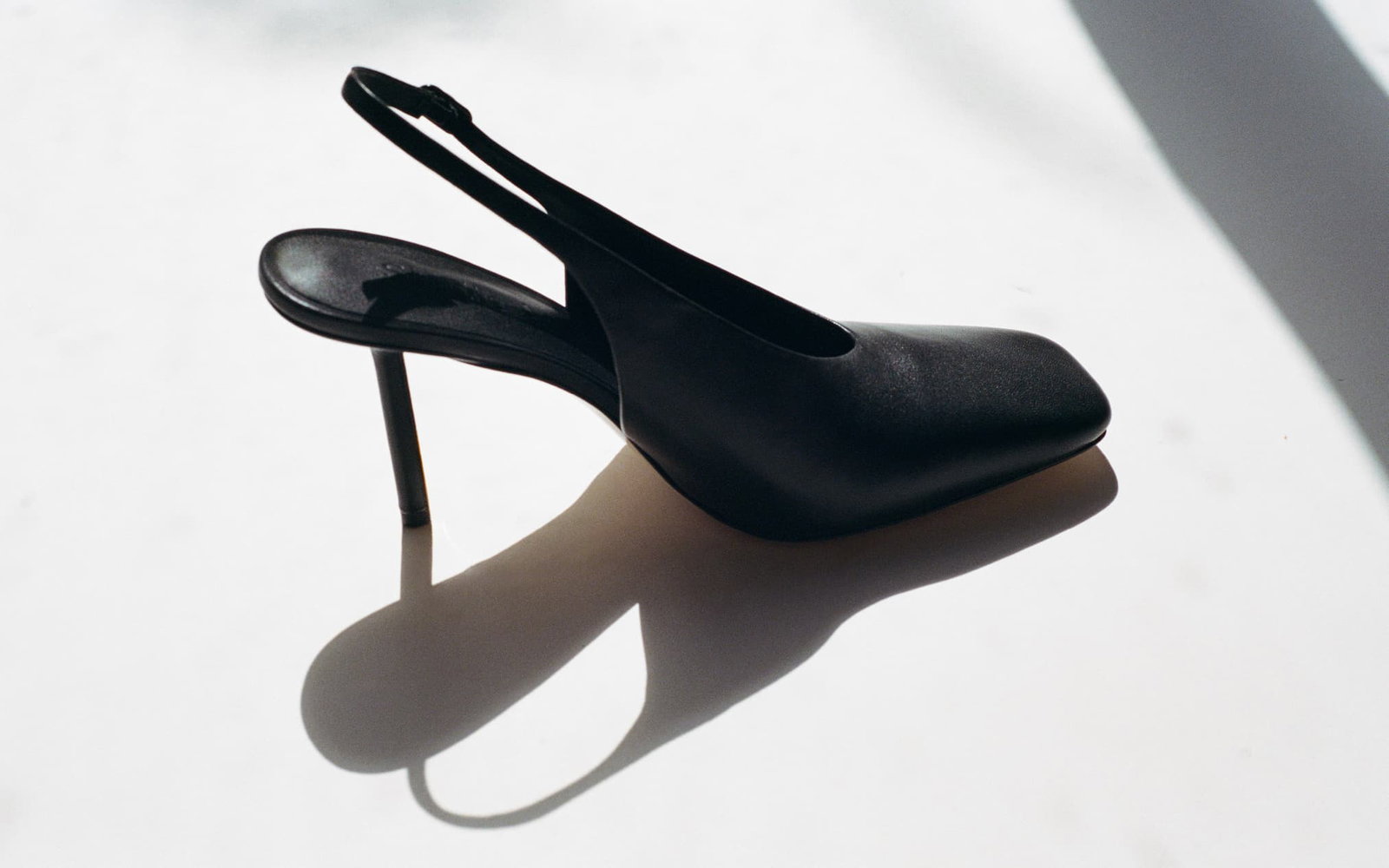 A black stiletto leather pump