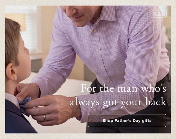 Dad ties son's bowtie, button says "Shop Father's Day Gifts"