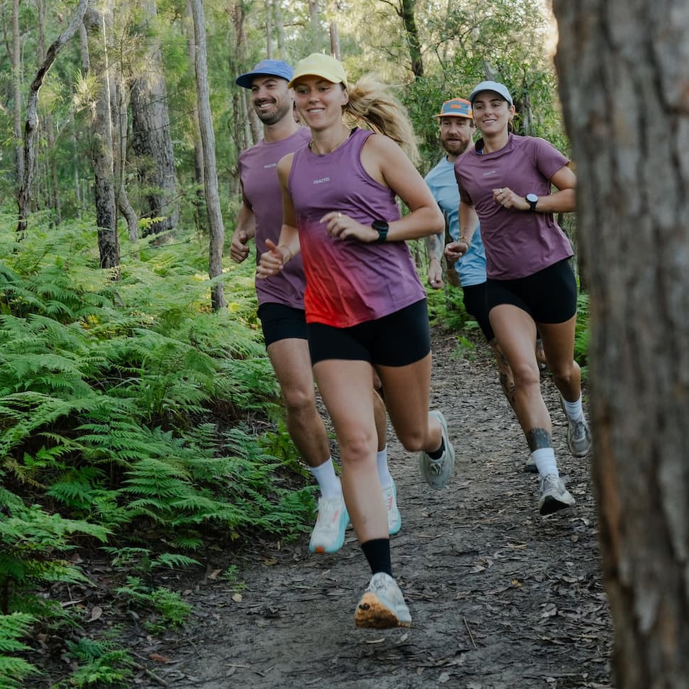 Fractel team members running through a forest